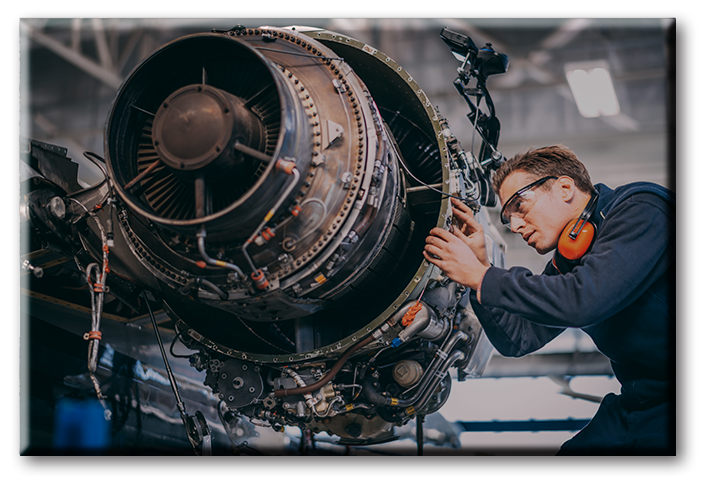 Certified Jet Mechanic working on a jet engine.